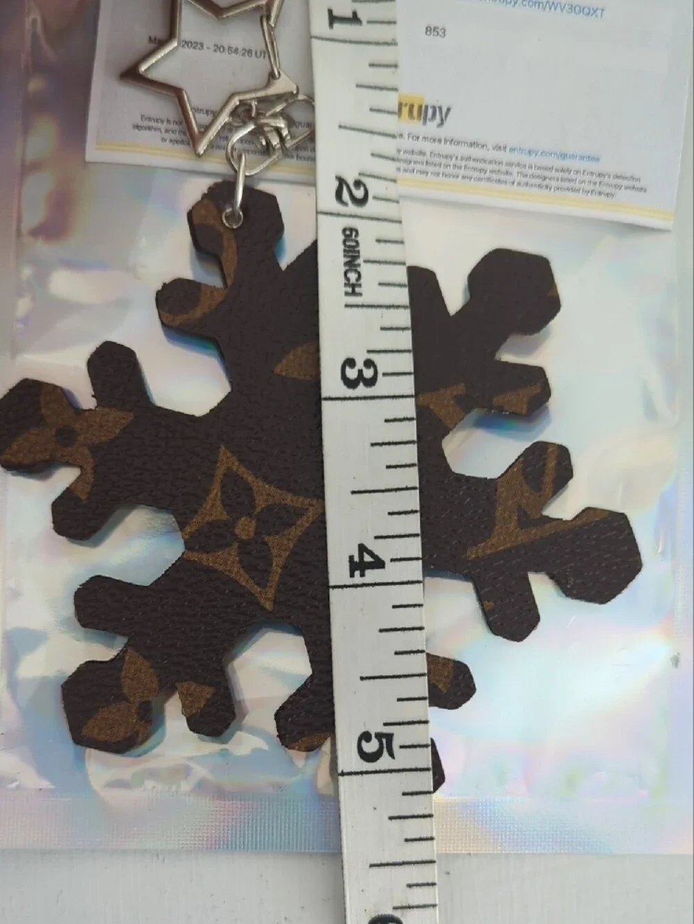 Louis Vuitton Brown Monogram Snowflake Key Charm with Silver Star Clasp COA Incl